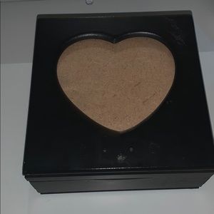 A jewelry box that is fully black.